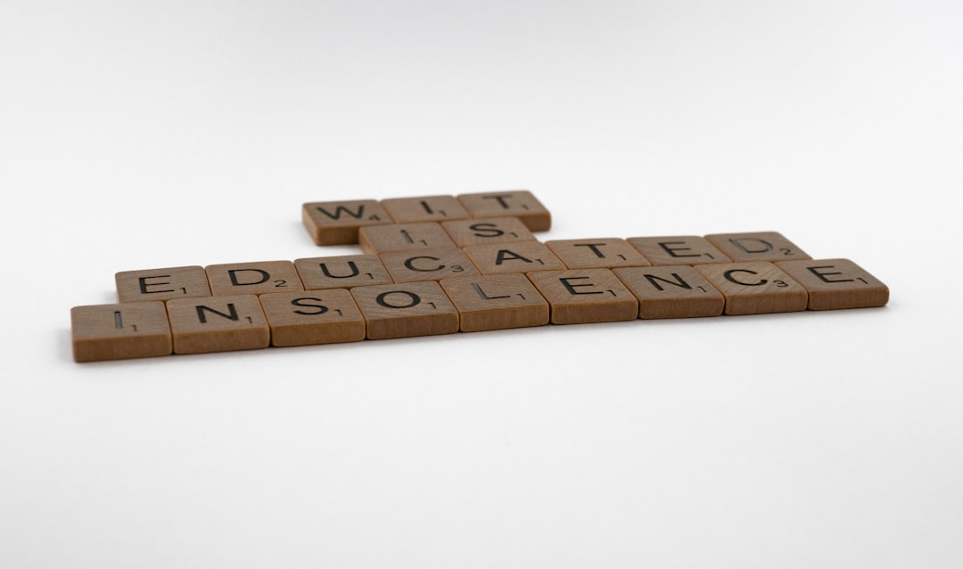 services-01 scrabble, scrabble pieces, lettering, letters, wood, scrabble tiles, white background, words, quote, letters, type, typography, design, layout, focus, bokeh, blur, photography, images, image, wit is educated insolence, wit, education, writing, humour, humor, intelligence, learning, socrates,